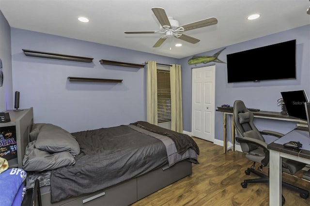 bedroom featuring ceiling fan and dark hardwood / wood-style flooring