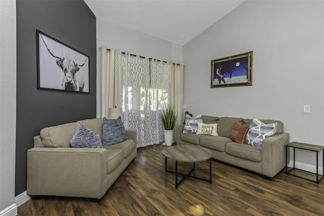 living room featuring vaulted ceiling and dark hardwood / wood-style floors