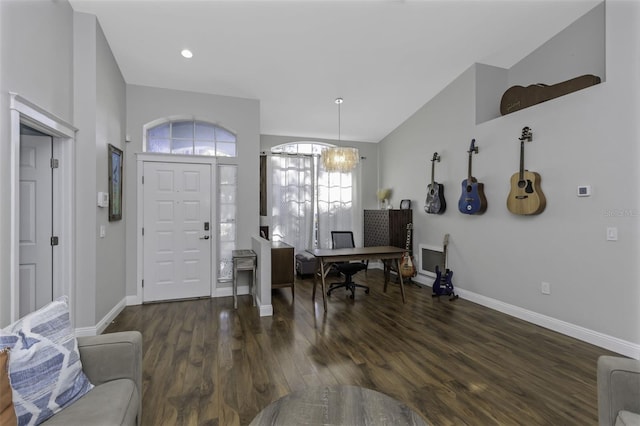 entrance foyer with dark wood-type flooring and lofted ceiling