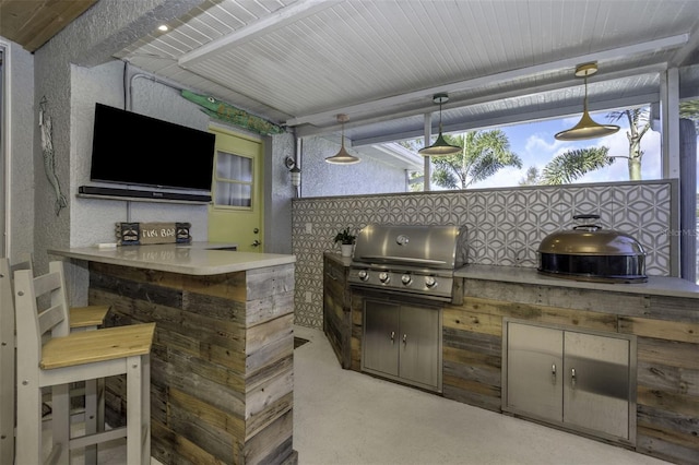 view of patio featuring an outdoor kitchen and grilling area