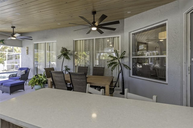 exterior space with ceiling fan