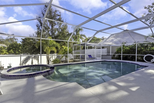 view of pool featuring a lanai, a patio, and an in ground hot tub