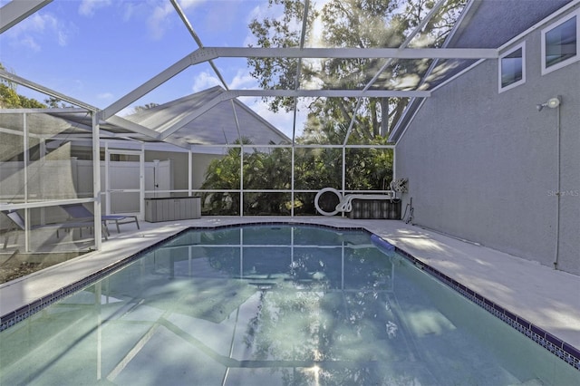 view of pool with a lanai and a patio area