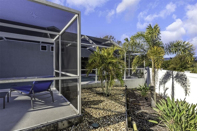 view of yard featuring a lanai and a patio area