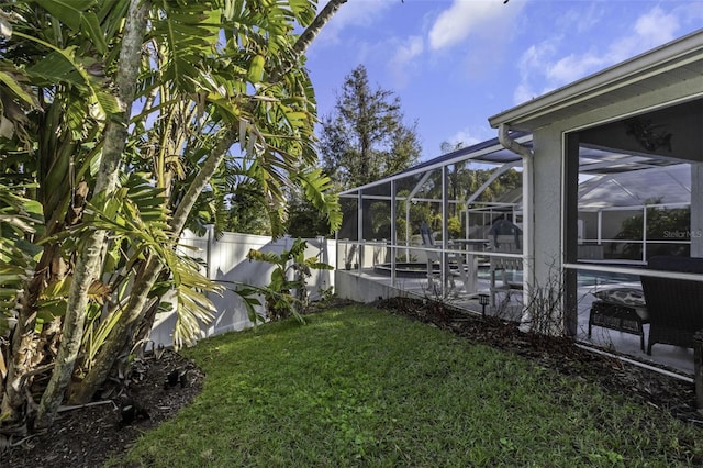 view of yard with a lanai and a patio