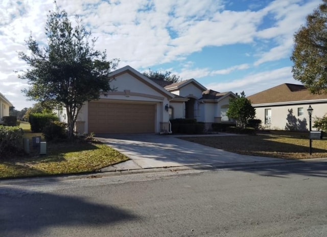 13026 SE 97th Terrace Rd, Summerfield, FL 34491 - ranch-style home with a garage