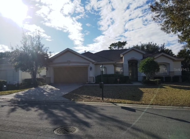 single story home featuring a garage