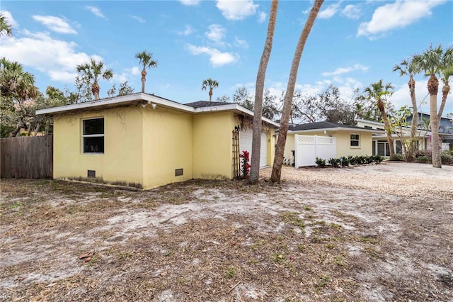 view of side of home with a garage