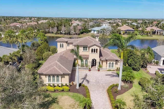 birds eye view of property featuring a water view and a residential view