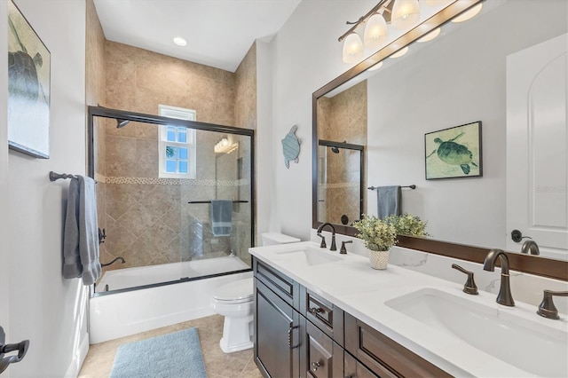 full bathroom with enclosed tub / shower combo, tile patterned flooring, a sink, and toilet