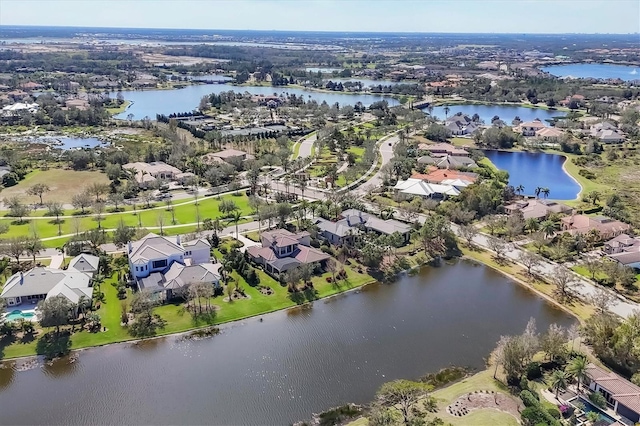 birds eye view of property with a residential view and a water view