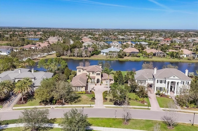 bird's eye view featuring a water view and a residential view