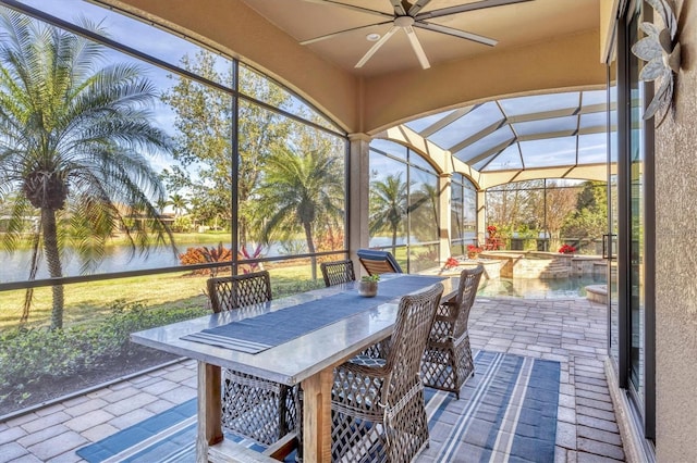 unfurnished sunroom featuring a water view and a wealth of natural light