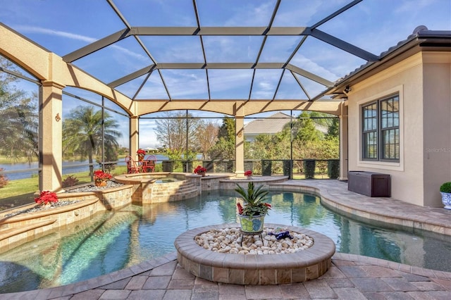 view of swimming pool with glass enclosure, a patio area, and a pool with connected hot tub