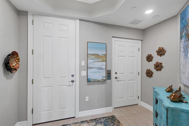 entrance foyer with light tile patterned floors