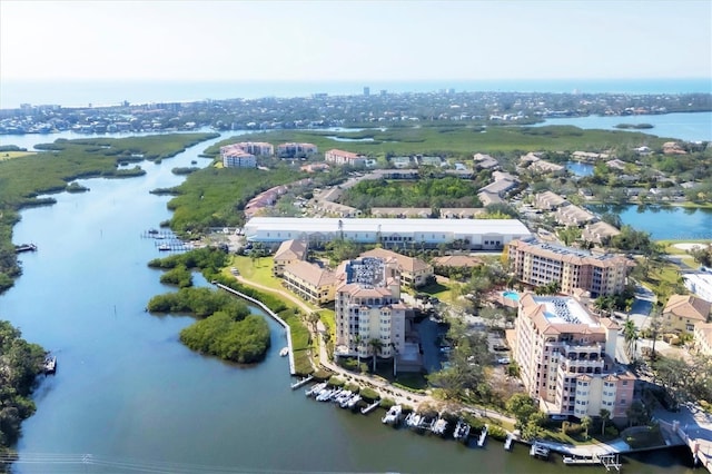 birds eye view of property with a city view and a water view