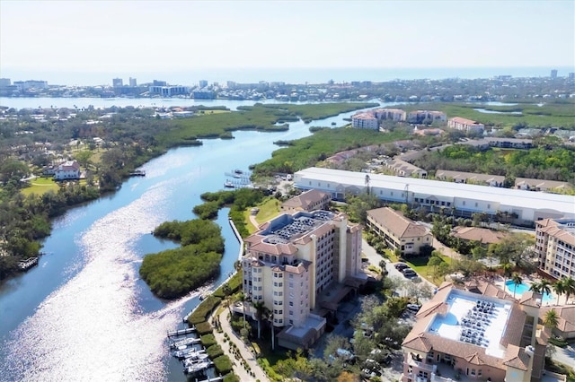 bird's eye view featuring a water view and a city view