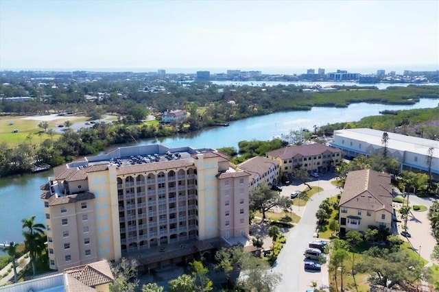 birds eye view of property featuring a water view and a city view