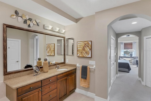 bathroom with vanity and baseboards