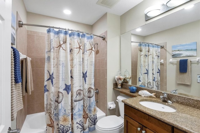 full bath with visible vents, shower / bath combination with curtain, toilet, and vanity