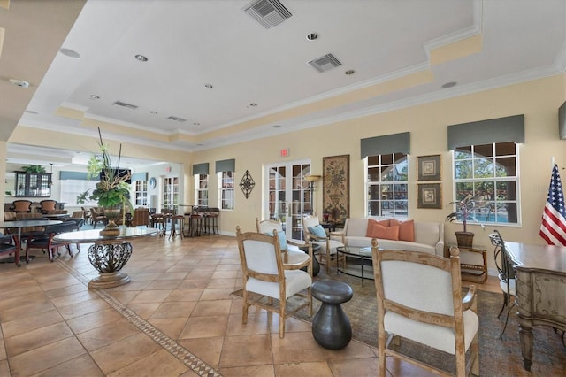 living room featuring visible vents, french doors, crown molding, and a tray ceiling