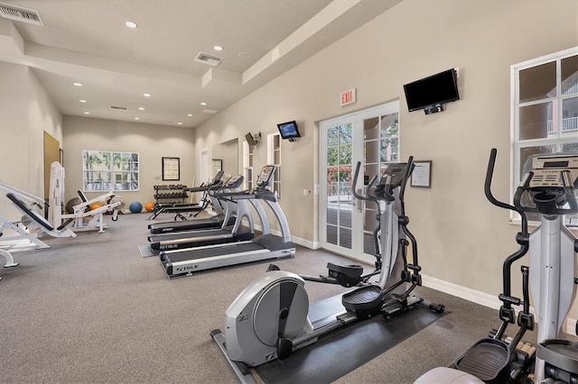 exercise room with recessed lighting, visible vents, and baseboards