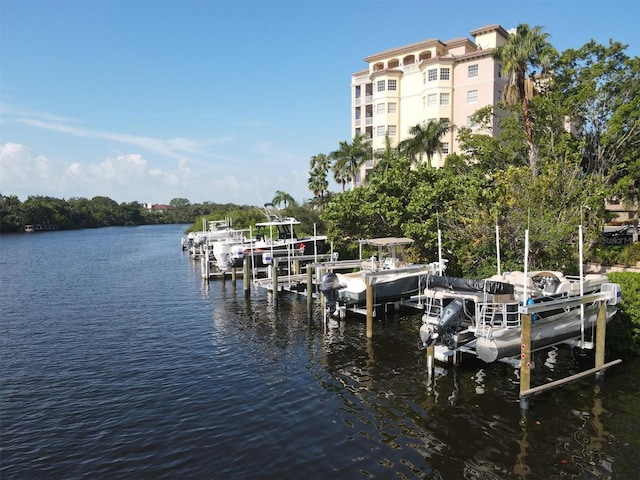 view of dock featuring boat lift and a water view