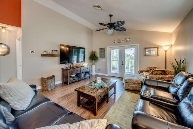 living room featuring french doors, ceiling fan, high vaulted ceiling, and light hardwood / wood-style flooring