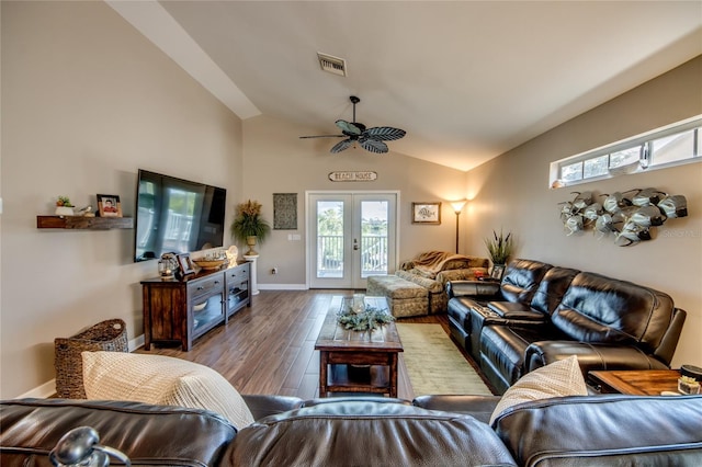 living room featuring french doors, ceiling fan, vaulted ceiling, and hardwood / wood-style flooring