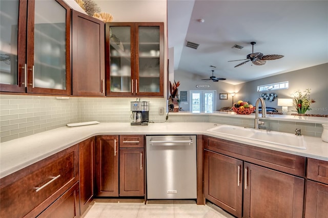 kitchen featuring tasteful backsplash, sink, and stainless steel dishwasher