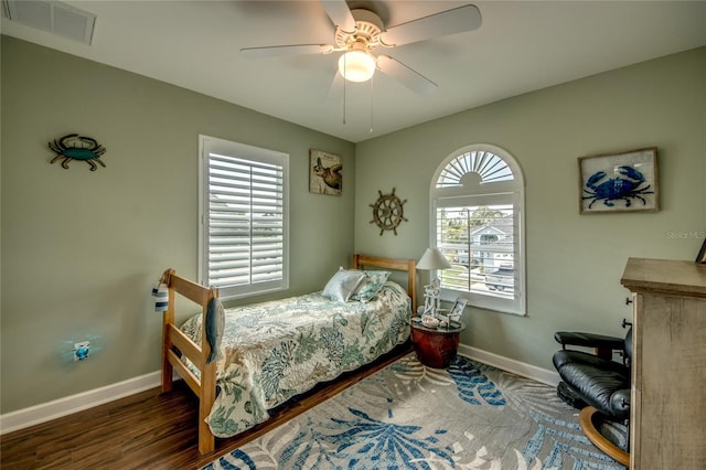 bedroom featuring dark hardwood / wood-style floors and ceiling fan