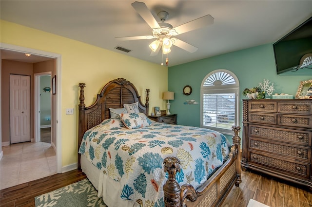 bedroom with dark wood-type flooring and ceiling fan