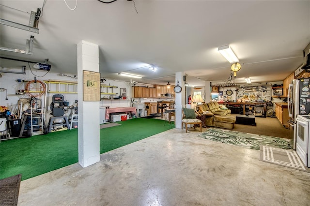 garage featuring a garage door opener and a workshop area