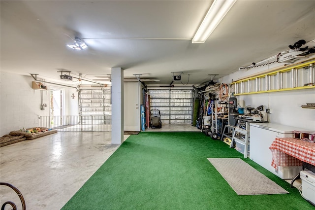 garage featuring a garage door opener, a yard, and refrigerator