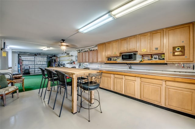 kitchen featuring light brown cabinets and ceiling fan