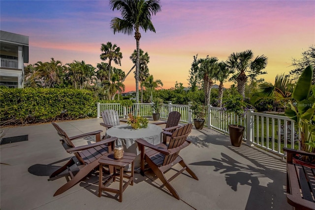 view of patio terrace at dusk