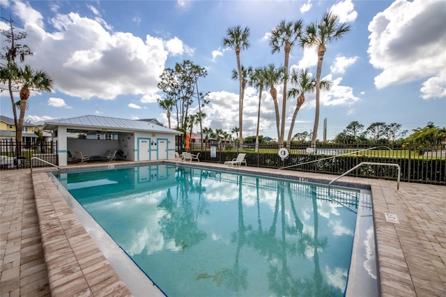 view of swimming pool featuring a patio area