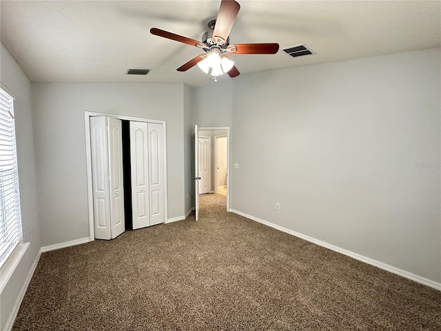 unfurnished bedroom with baseboards, carpet flooring, visible vents, and a ceiling fan