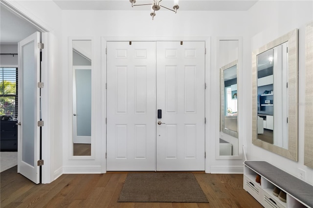 foyer entrance with dark hardwood / wood-style floors