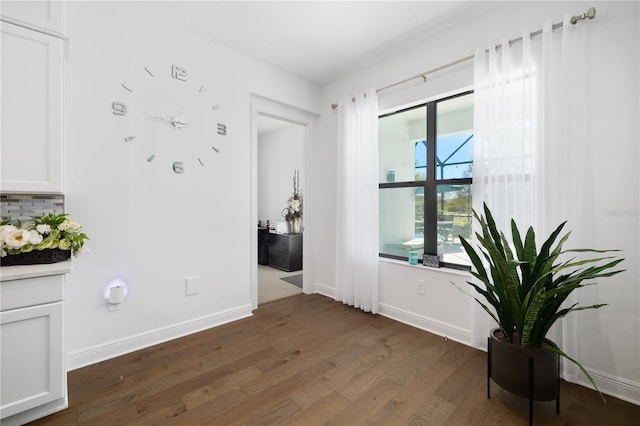 corridor featuring dark hardwood / wood-style floors