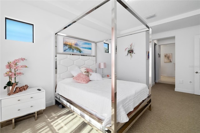 bedroom featuring light colored carpet