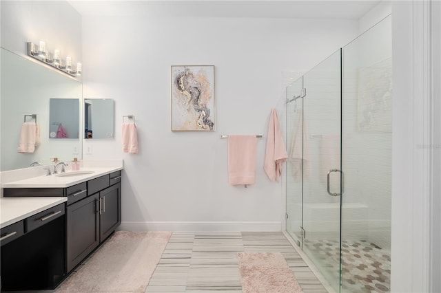 bathroom with vanity and an enclosed shower