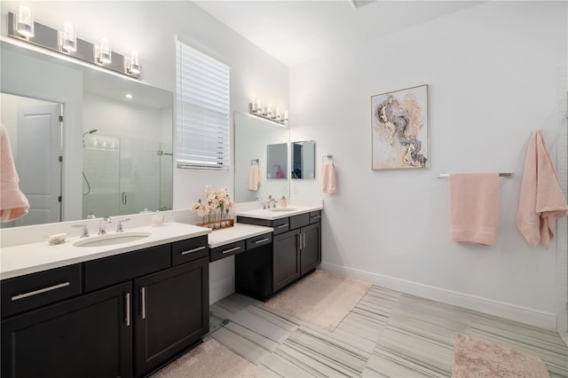 bathroom featuring an enclosed shower and vanity