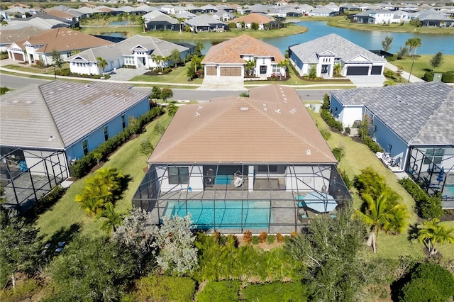 birds eye view of property featuring a water view