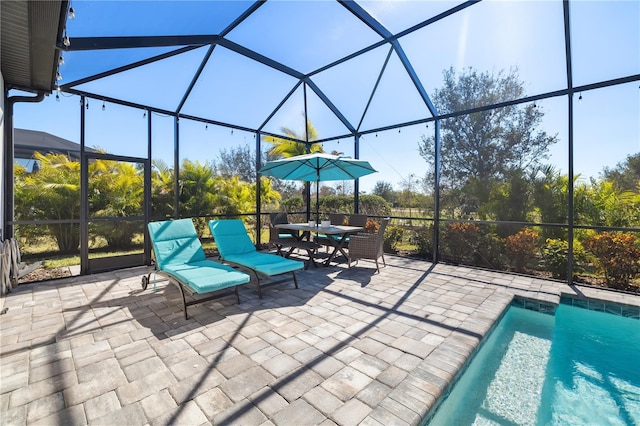 view of patio / terrace featuring glass enclosure