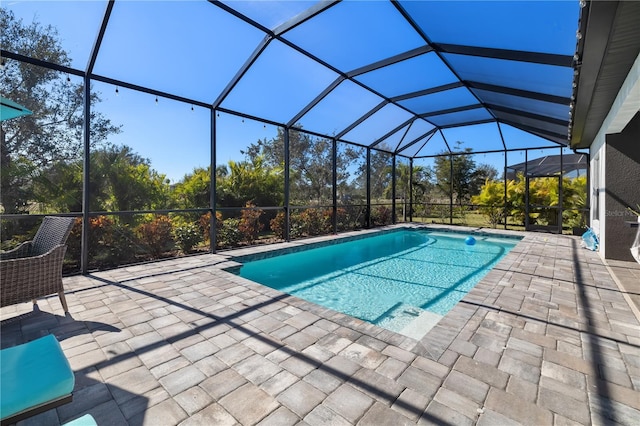 view of pool featuring a lanai and a patio area