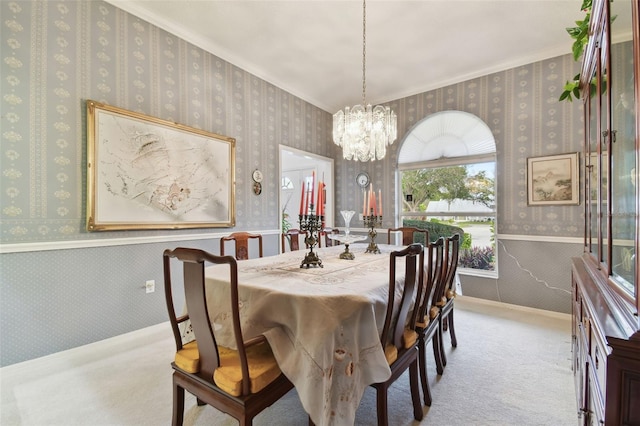 dining area featuring light carpet and a notable chandelier