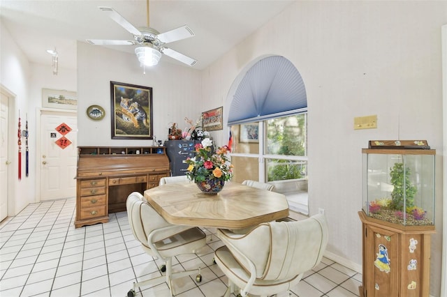 tiled dining space with ceiling fan