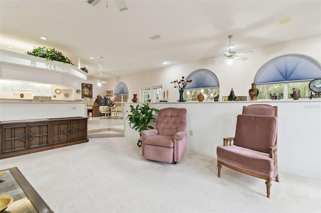 sitting room with light carpet and ceiling fan