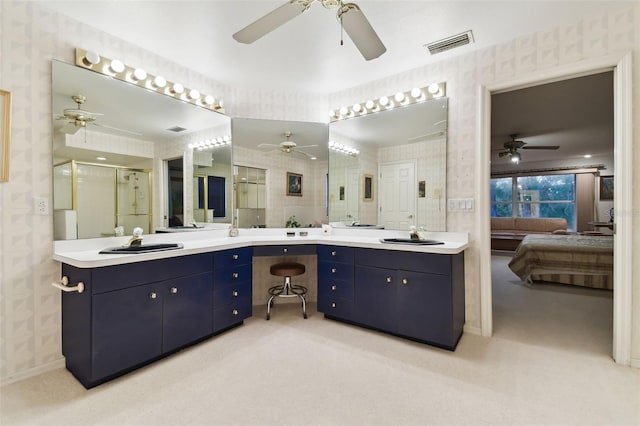 bathroom featuring vanity and a shower with shower door